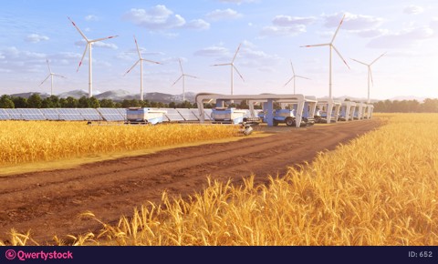 Futuristic harvesters on field with solar panels and windmills in the background 4K video 652